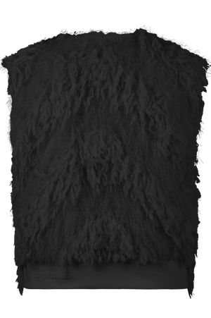 Schwarze, pelzartige Textur auf einem Oberteil.
